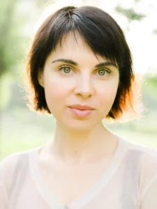 Selective Focus Photography of Woman Wearing White Top